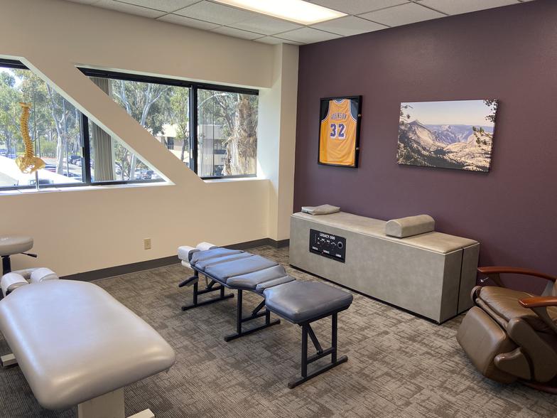 Treatment room at Positive Edge Chiropractic in Scripps Ranch, with adjustment tables and a bright window